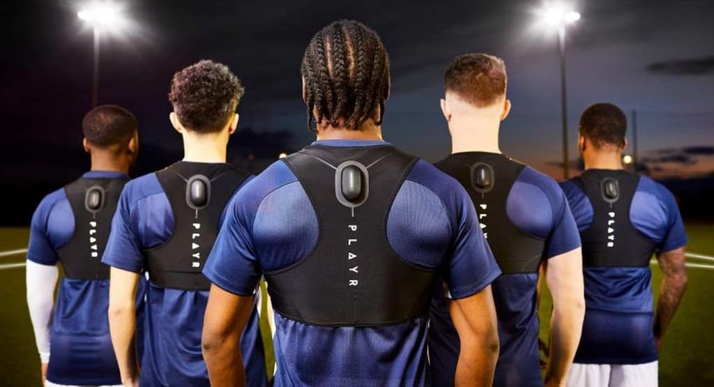 Advancements in Training and Performance in sports technology. An athlete using cutting-edge sports technology during training. The scene features wearable sensors tracking biometric data, a virtual reality headset simulating game scenarios, and a smart treadmill displaying real-time performance analytics on an adjacent screen. A coach is seen analyzing data on a tablet, highlighting the role of technology in optimizing athletic performance."
Let me know if you'd like adjustments or have a specific image style in mind!