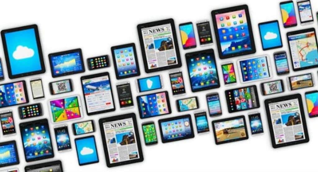 A variety of mobile data collection devices, including a rugged tablet, a smartphone, and a handheld barcode scanner, placed on a desk with data collection software displayed on their screens."
Let me know if you'd like it customized further!