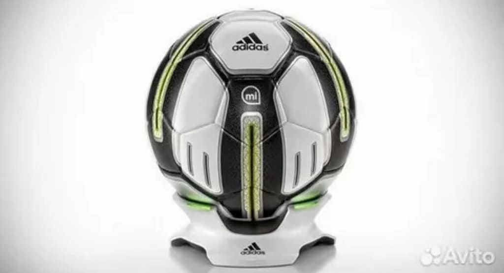 An athlete using cutting-edge sports technology during training. The scene features wearable sensors tracking biometric data, a virtual reality headset simulating game scenarios, and a smart treadmill displaying real-time performance analytics on an adjacent screen. A coach is seen analyzing data on a tablet, highlighting the role of technology in optimizing athletic performance."
Let me know if you'd like adjustments or have a specific image style in mind!