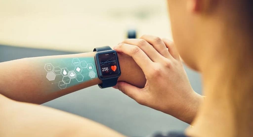 An athlete wearing a thermal imaging wearable device during training, with a visual overlay of infrared heat patterns highlighting muscle activity and potential inflammation, showcasing its role in injury prevention and recovery optimization.