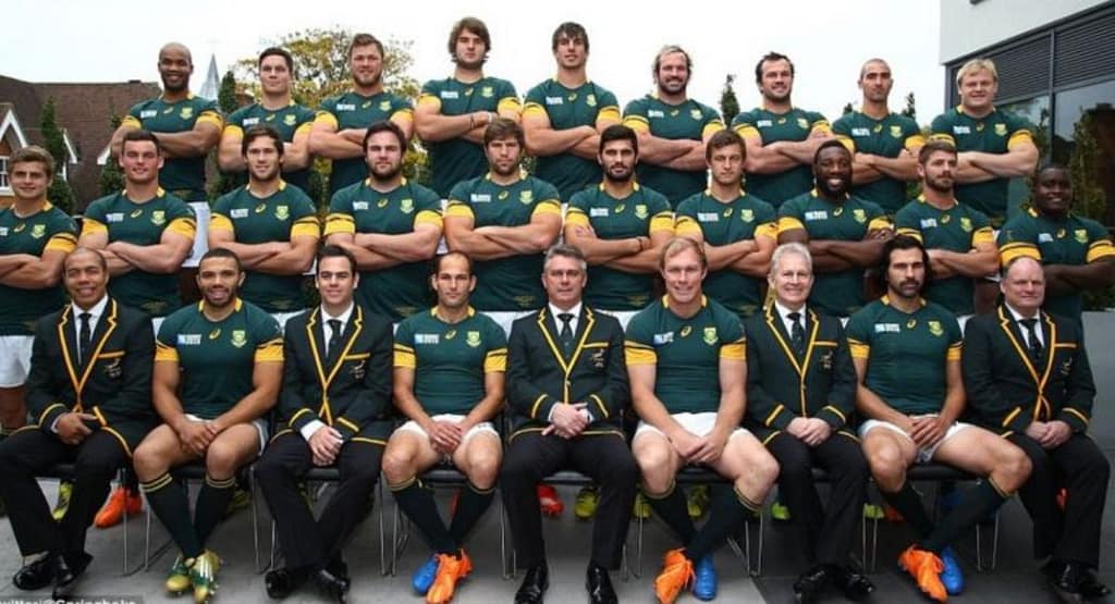 "Benjie Bougas Rugby action shot, showcasing agility and determination as he evades a tackle while sprinting forward with the ball."