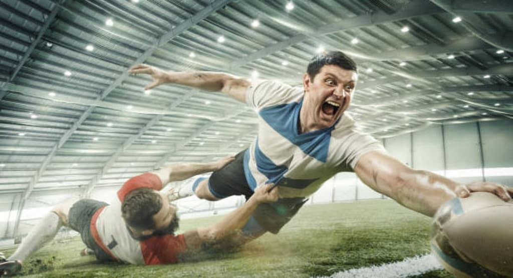 "Dynamic digital artwork of a rugby player in a green jersey representing Churcher’s Pinelands Rugby, holding a Gilbert rugby ball while in motion. The background features an energetic splash of green and white, symbolizing speed, passion, and tradition in the sport. The player's focused expression and athletic stance highlight the excellence and dedication associated with the team." Pinelands Sports Club: A Hub for Rugby and More