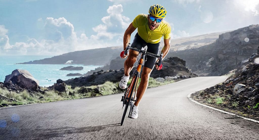 "Close-up view of power meter pedals installed on a bicycle, highlighting their advanced features for tracking cycling performance, with a focus on the rider's smile as they prepare for a ride." Why is Power Important in Cycling