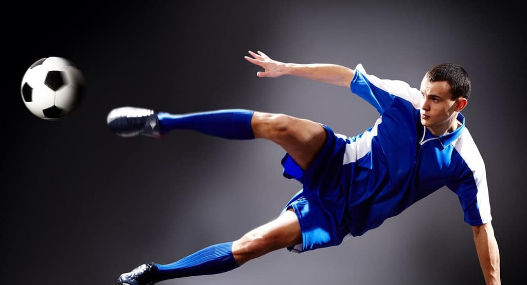 "An athletic football player demonstrating the physical traits of a linebacker in football—strength, agility, and coordination. Wearing a white and red uniform, he leaps with focus to intercept the ball against a dramatic cloudy sky backdrop."