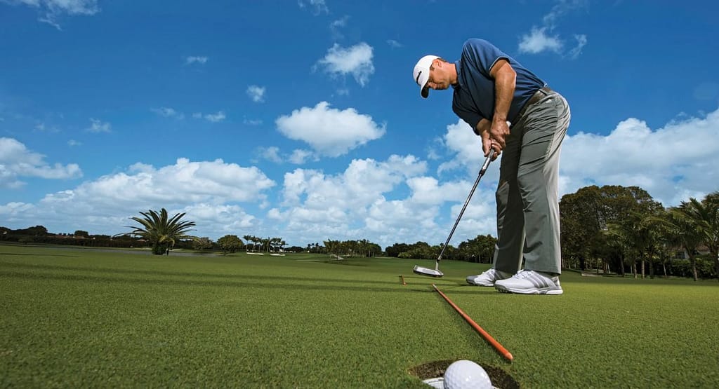 Golfer mid-swing with motion lines and joint angles illustrating the mechanical aspects of proper form.